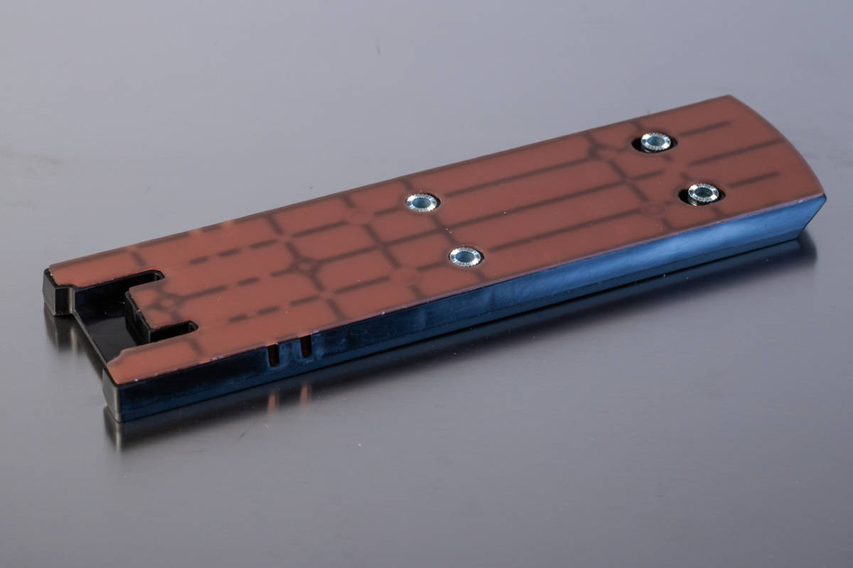 Plastic component with overmoulded metal sleeves